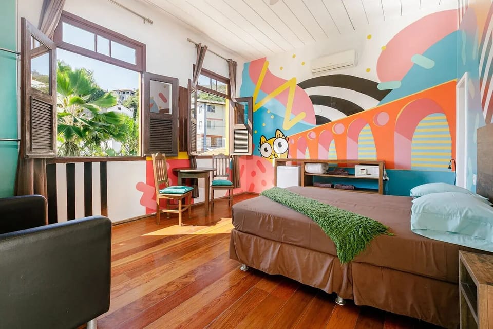 Design Double Room, 1 Queen Bed, Ensuite, Mountain View | Pillowtop beds, minibar, individually decorated, desk