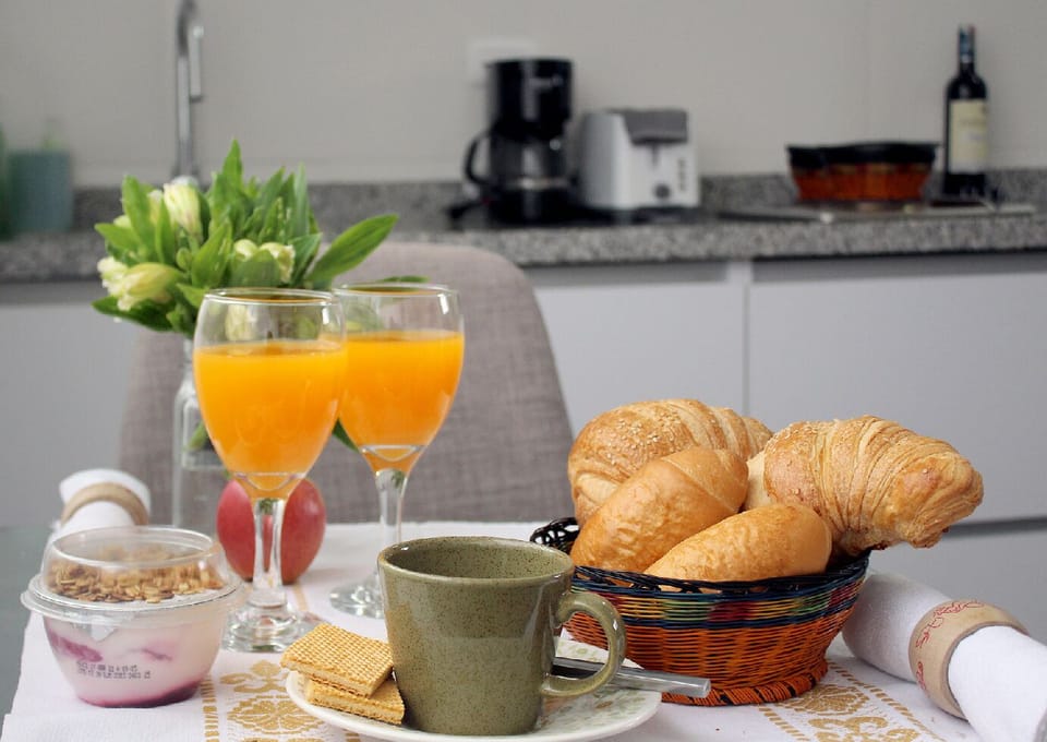 Enjoy a hearty breakfast with a sunny view of Montserrate on a perfect morning