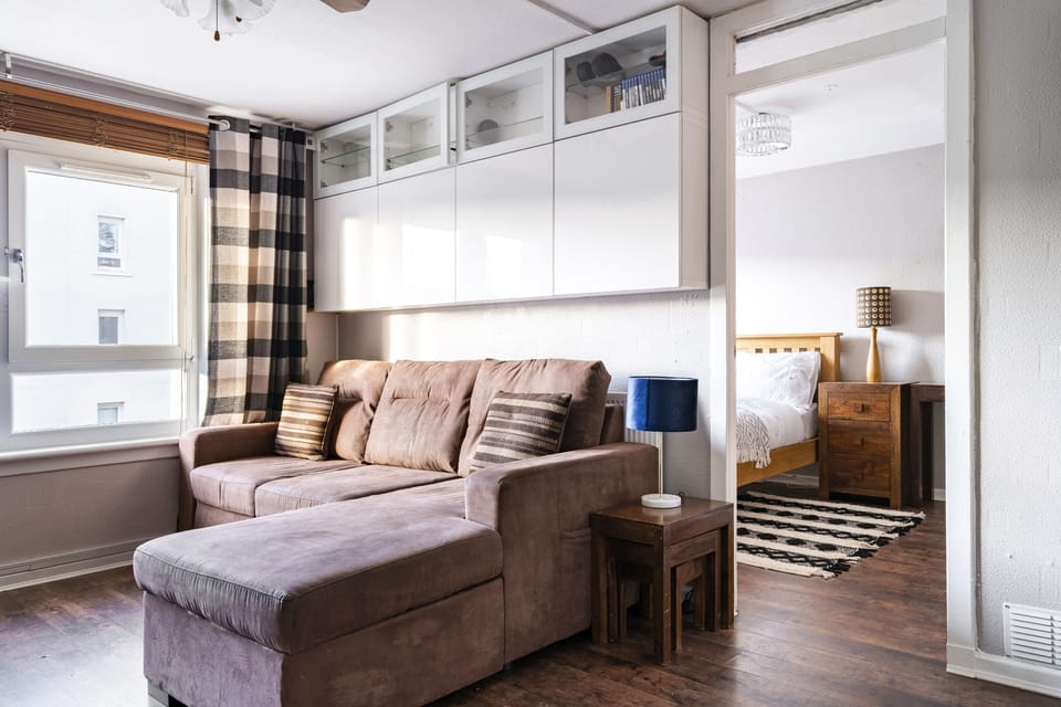 Living room area looking into the bedroom area