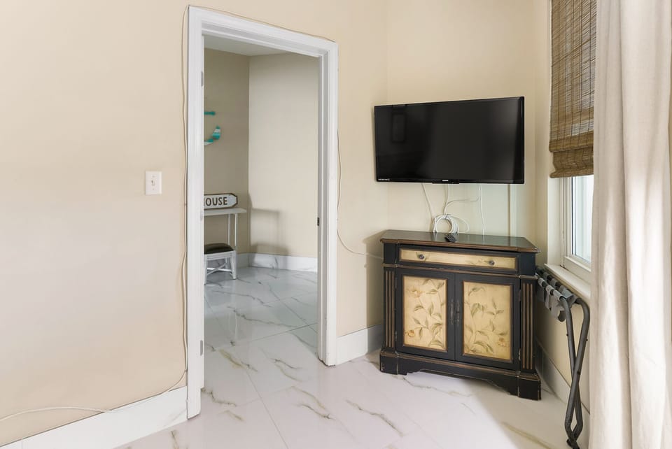 Relax in your elegantly appointed space with modern entertainment and charming décor, featuring beautiful marble floors that flow throughout.
