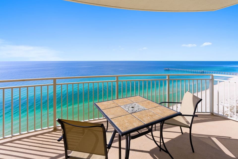 Sip your morning coffee at your private table while soaking in stunning turquoise waters and endless ocean views from your beachfront balcony.