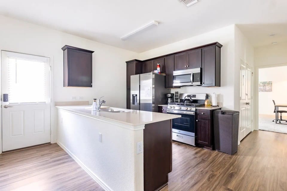 Our kitchen is equipped with a gas stove, over-range microwave, dishwasher, and complete dining ware, ensuring convenience and efficiency for all your culinary needs.