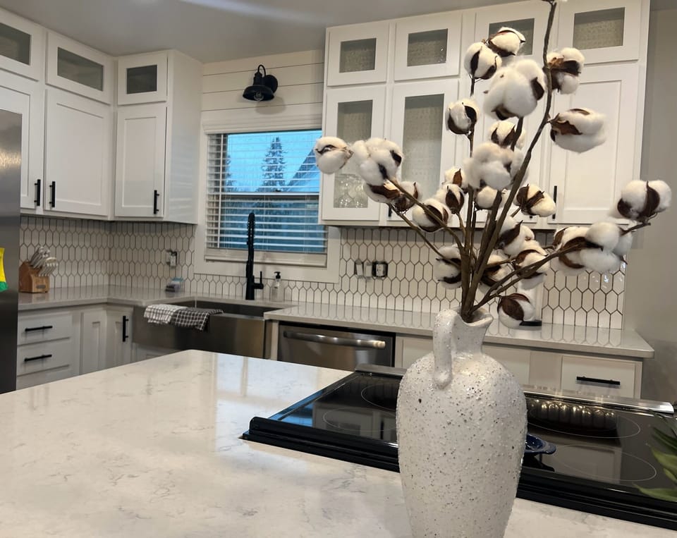 New kitchen with sparkling quartz countertops, new appliances, custom cabinets