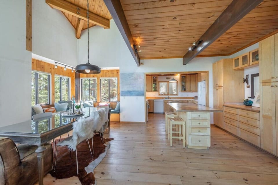 Dining area, built-in window seats and open kitchen.