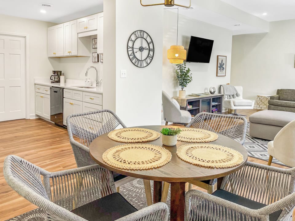Open floor plan showing view from dining area to kitchen and living room