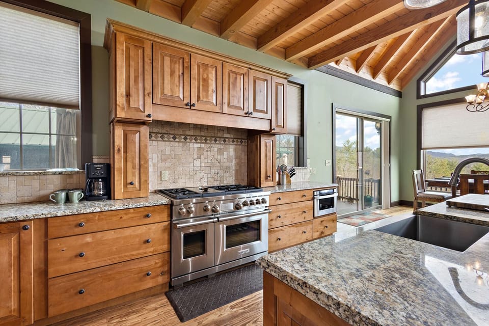 Large Gas Range and Granite Countertops