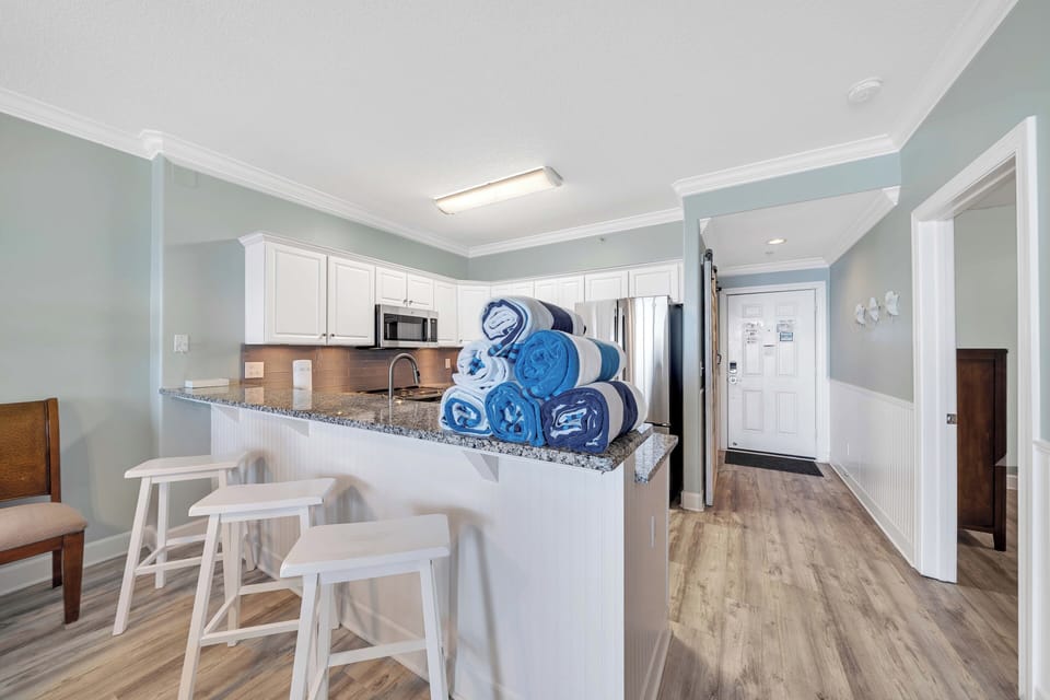 The 42-inch high-top counter has plenty of space for 3 people to enjoy a snack.