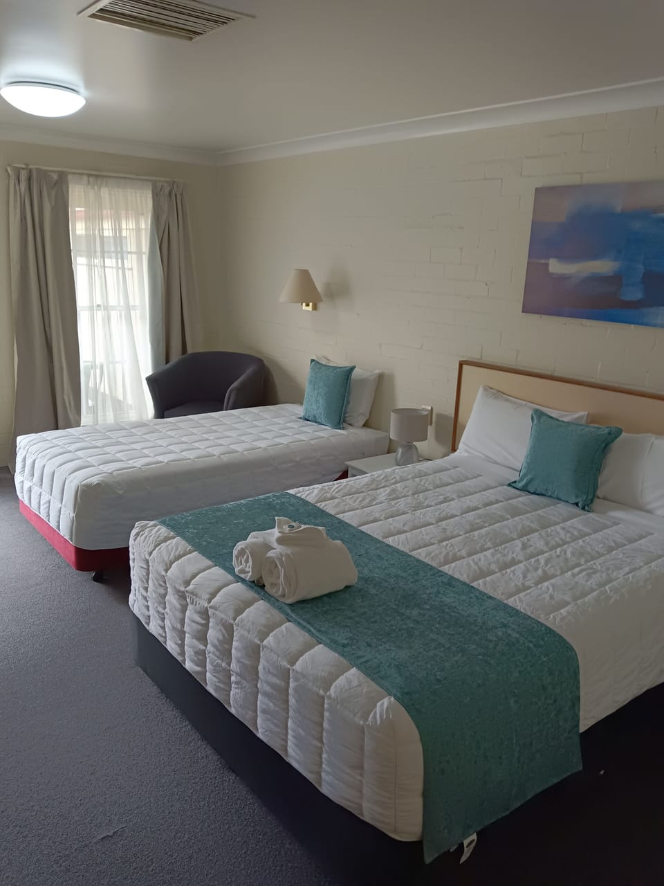 Premium bedding, desk, laptop workspace, soundproofing