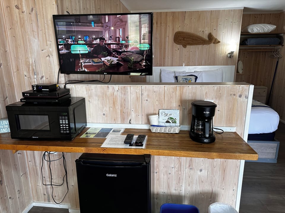 Deluxe King Room Ocean View to Deluxe King Room Oceanfront (No Pets) | Living area | LCD TV, DVD player