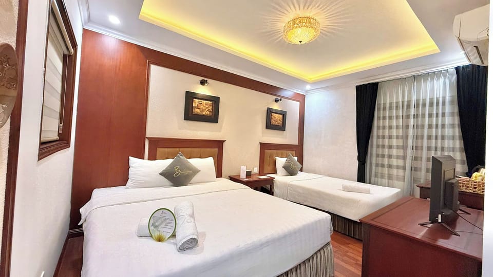 Family Triple Room | Minibar, desk, laptop workspace, soundproofing