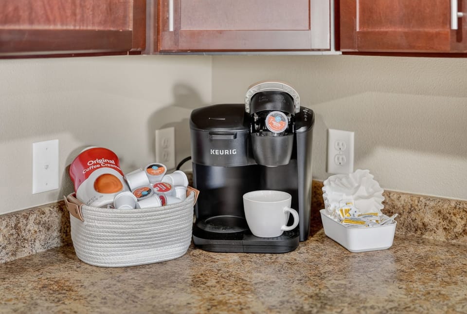 Convenient Keurig coffee station with pods, mug, and all the essentials