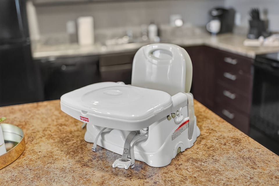 Family-friendly kitchen with child booster seat for added convenience