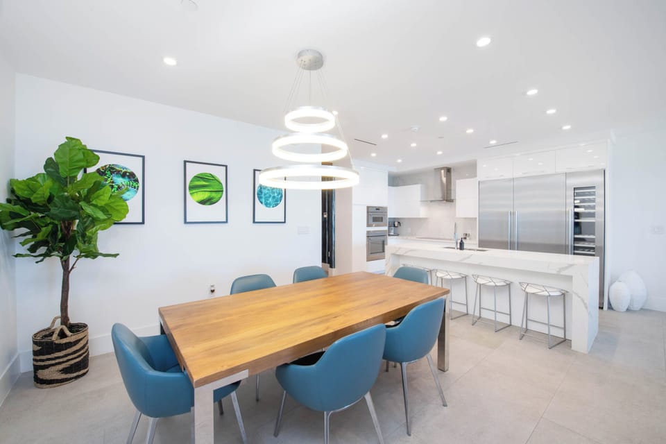 Modern dining table and gourmet kitchen. 