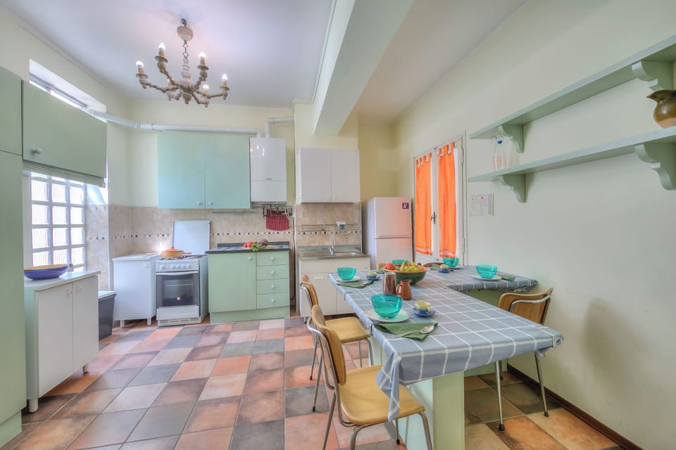 Family Apartment, Multiple Bedrooms, Lakeside (Il Porticciolo Stresa Stunning Lake) | Private kitchen | Fridge, oven, stovetop, coffee/tea maker
