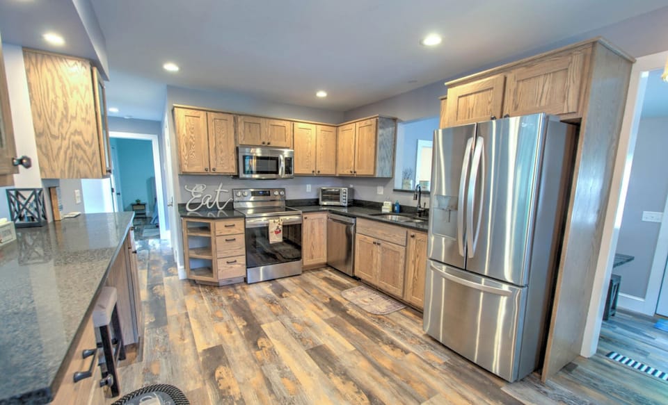 Fully equipped kitchen with toaster oven, two coffee options and crock pot.