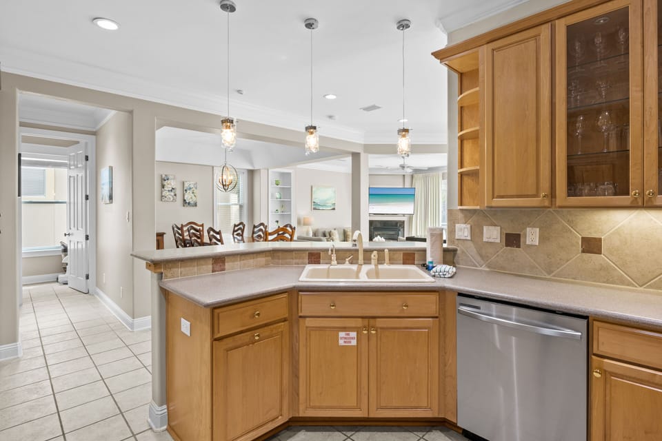 Your gourmet kitchen features granite counters, stainless appliances, and warm wood cabinets perfect for preparing memorable meals.