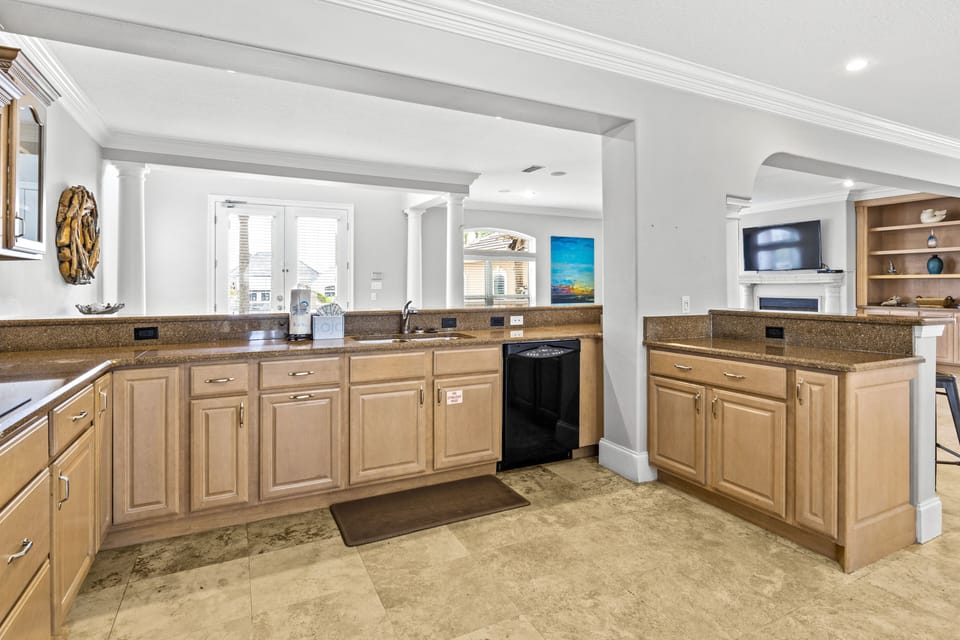 Your gourmet kitchen features granite countertops, ample cabinetry, and modern appliances, perfect for preparing meals during your stay.