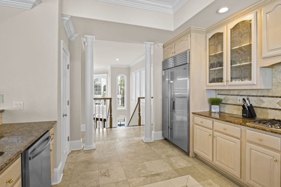 Your spacious gourmet kitchen features granite countertops, stainless steel appliances, and elegant cabinetry perfect for preparing memorable meals during your stay.