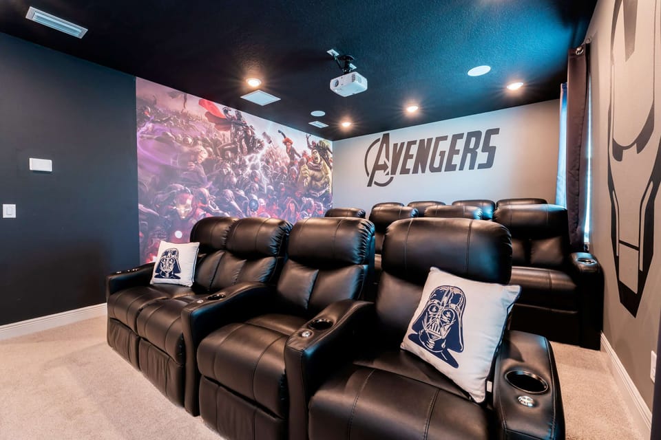 Experience epic movie nights in this Avengers-themed theater with plush recliners and immersive decor.