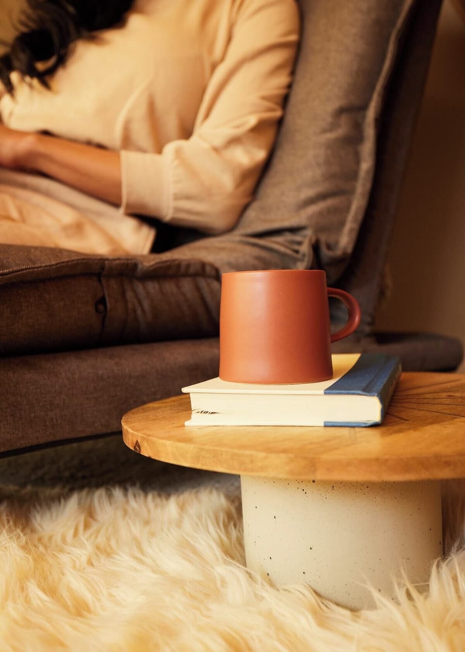The loft bedroom boasts a queen-sized mattress with luxurious bedding, and a cozy recliner chair perfect for reading. Wake up to stunning views of Pikes Peak mountain right from the comfort of your bed.