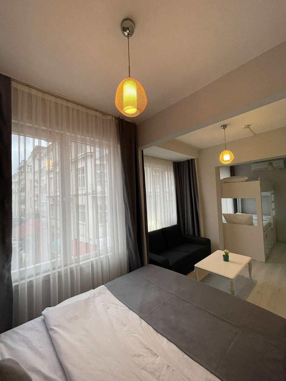 Standard Quadruple Room | Minibar, in-room safe, soundproofing, iron/ironing board