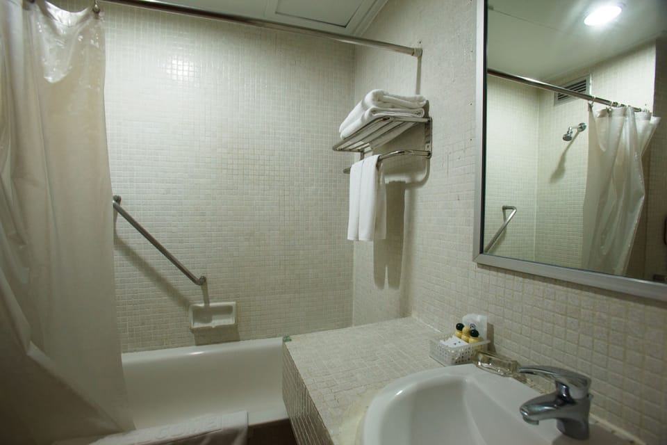 Standard Room | Bathroom | Combined shower/tub, deep soaking tub, rainfall showerhead