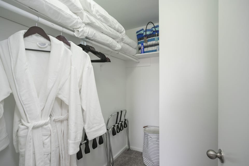 Plenty of closet space. Robes, luggage racks, pool bag & towels. 