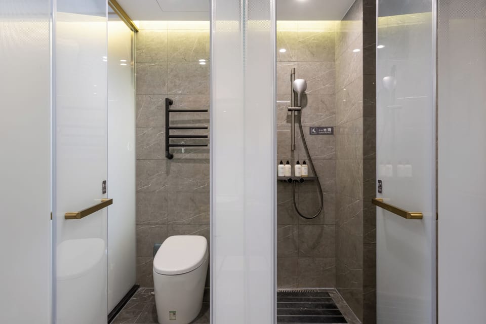 Shower, hair dryer, slippers, shampoo