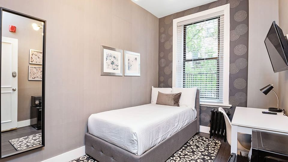 Desk, laptop workspace, free WiFi, bed sheets
