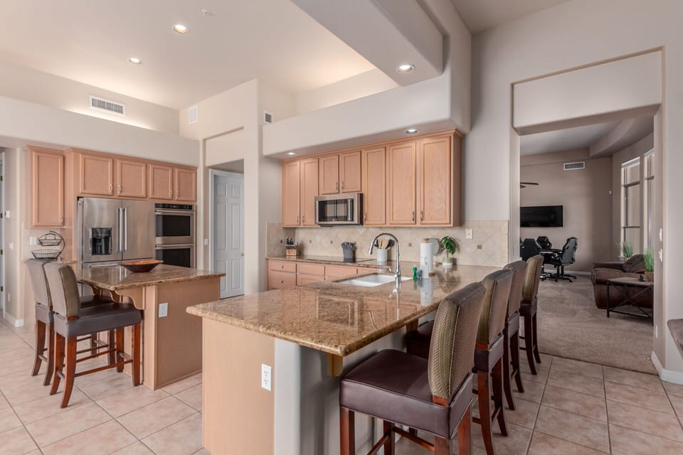 Spacious kitchen fully stocked for your cooking needs. Bar top seating for six. 