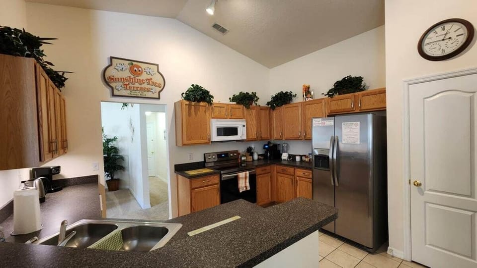 Full kitchen with coffee maker, slow cooker, and more.