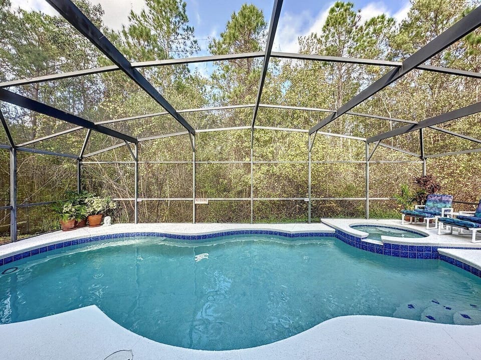 Private pool backs up to wooded area providing privacy