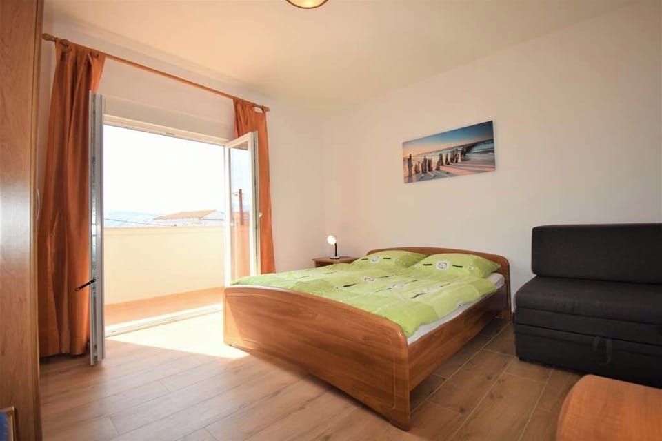 Bright bedroom with storage and fresh linens.