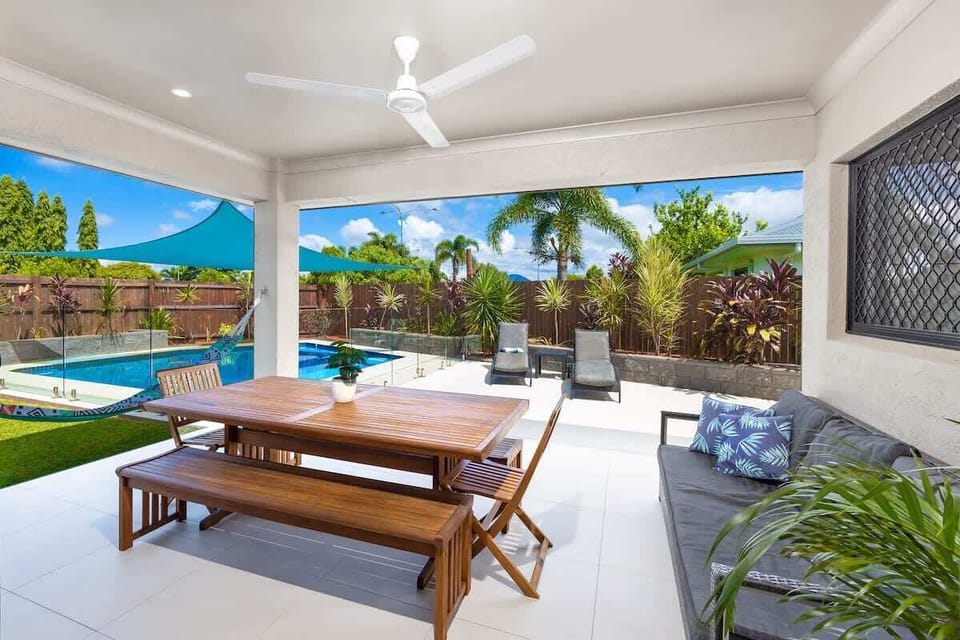 Enjoy leisurely breakfasts, shared lunches, or sunset drinks from the spacious alfresco dining area overlooking the pool and backyard.