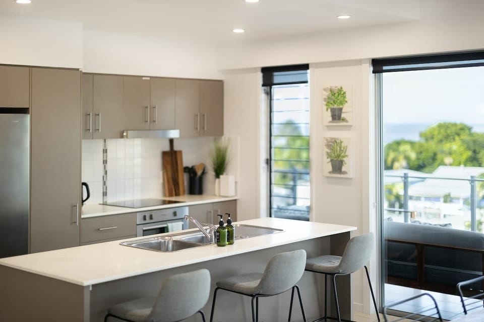 The spacious kitchen island creates a natural gathering place for morning coffees, casual meals and planning the day's adventures.