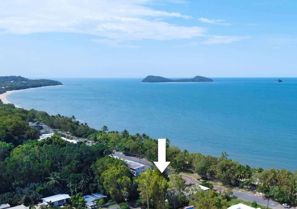 An exceptional Esplanade position places the home moments from the sand, surrounded by tropical greenery and coastal beauty.