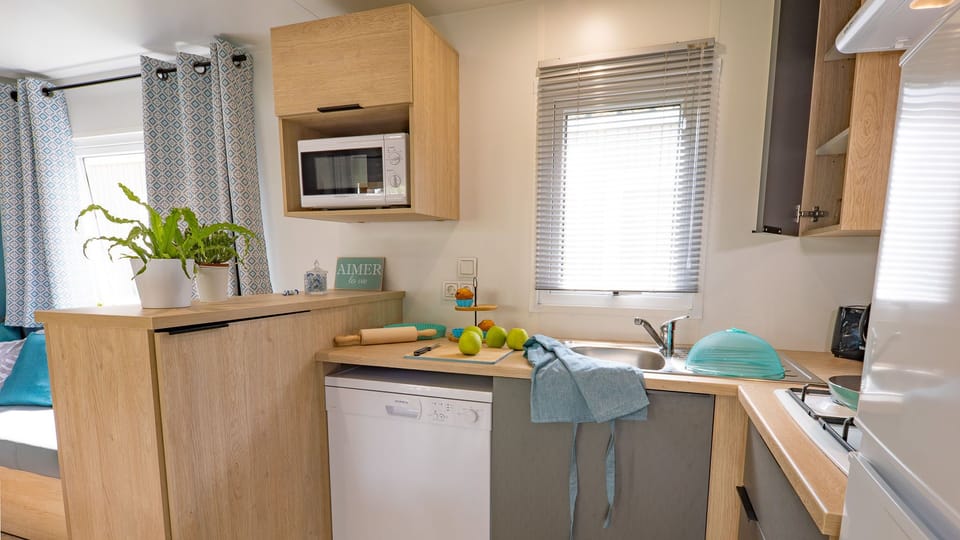 Compact and modern kitchen with all essentials, perfect for preparing meals during your stay.