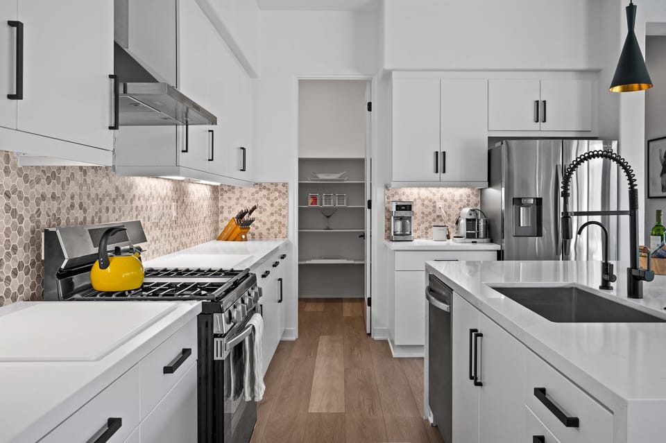 Chef's kitchen and pantry with amenities for cooking and entertaining