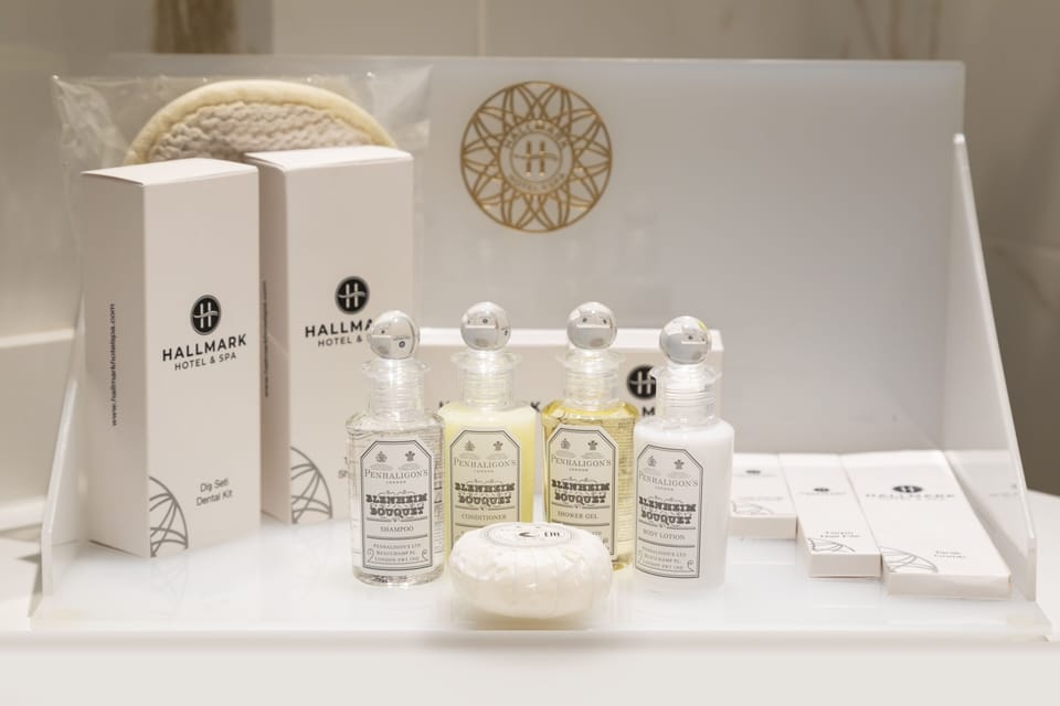 Shower, rainfall showerhead, designer toiletries, hair dryer
