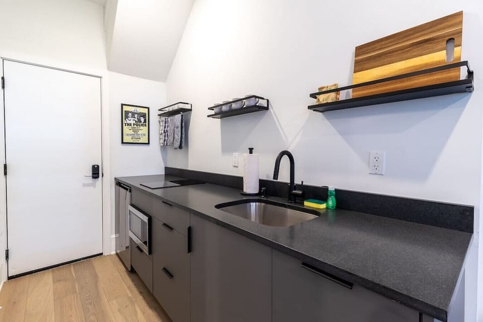 `Sleek and stylish kitchenette with modern finishes — perfect for quick meals