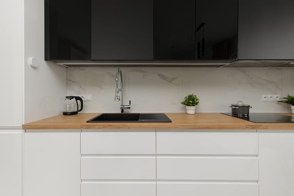 Another view of the stylish kitchen with its functional layout and decorative accents, including small