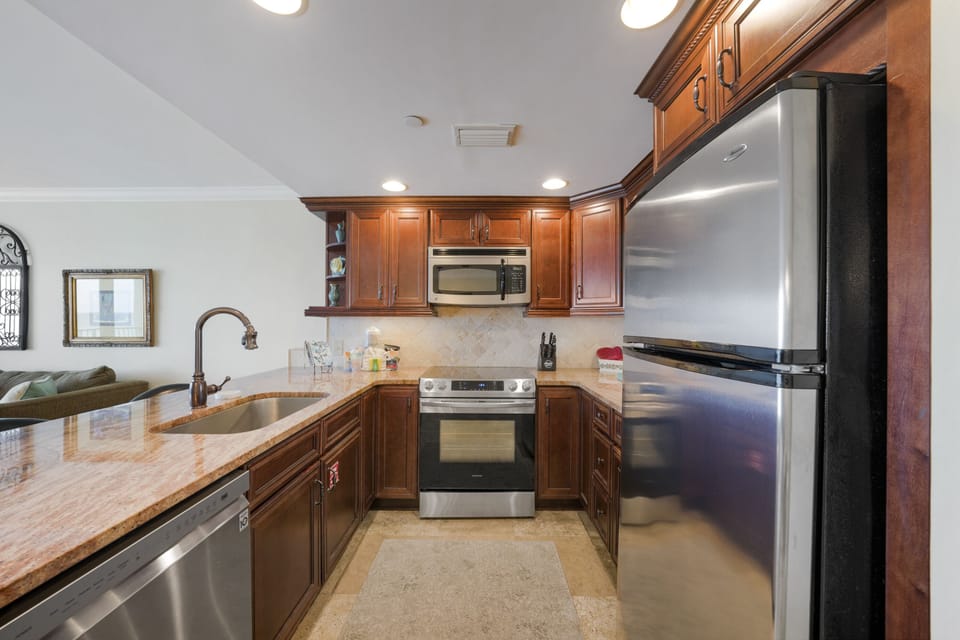 Cooking feels effortless when your vacation home is as comfortable and well equipped as this beachfront condo.