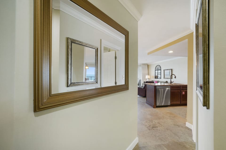 Step inside Cabana Club 406 and follow the welcoming hallway as it opens into your private beachfront retreat in Destin, Florida.