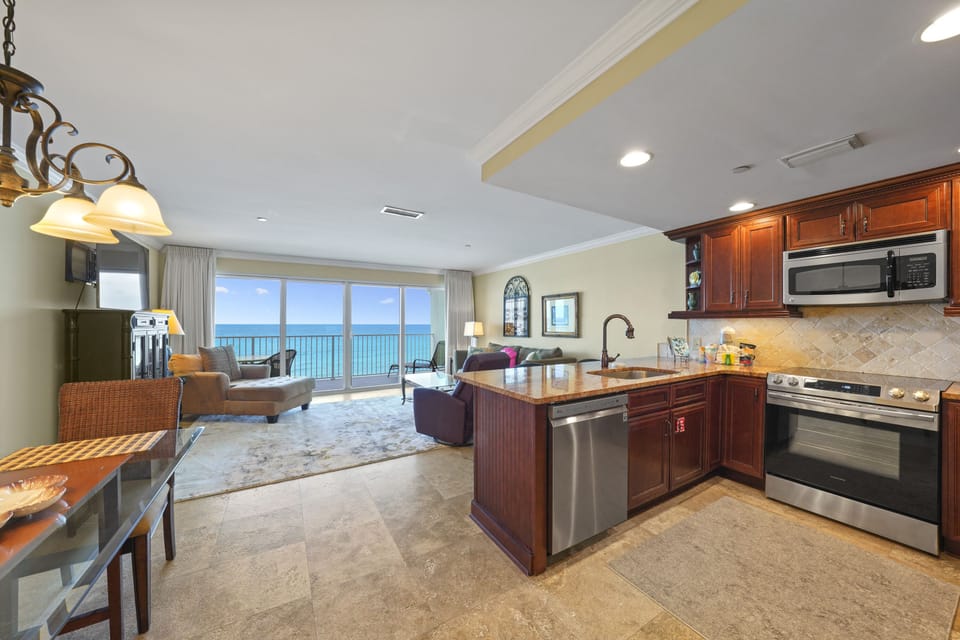 Even simple moments, like pouring a drink or unpacking groceries, feel elevated with an ocean backdrop.