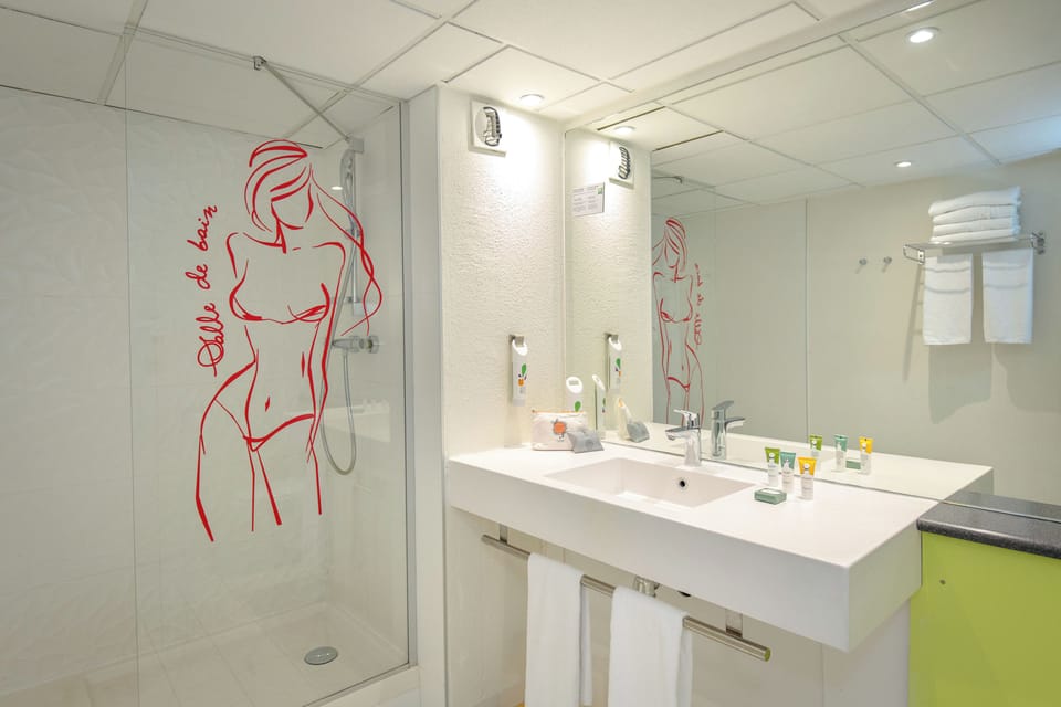Standard Suite, Multiple Beds | Bathroom | Shower, eco-friendly toiletries, hair dryer, towels