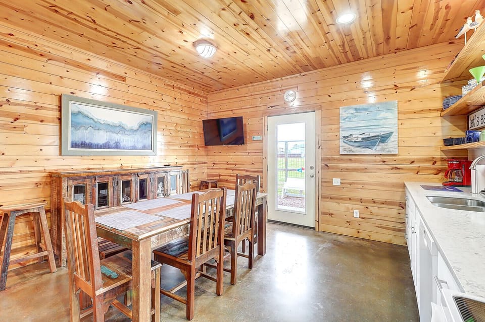 Interior - Enormous eat-in kitchen with mounted television. The perfect place for cooking and gathering.