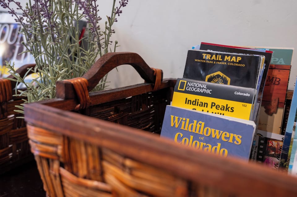 Discover local Colorado adventures with these curated guidebooks and trail maps, perfectly arranged for your mountain getaway planning.