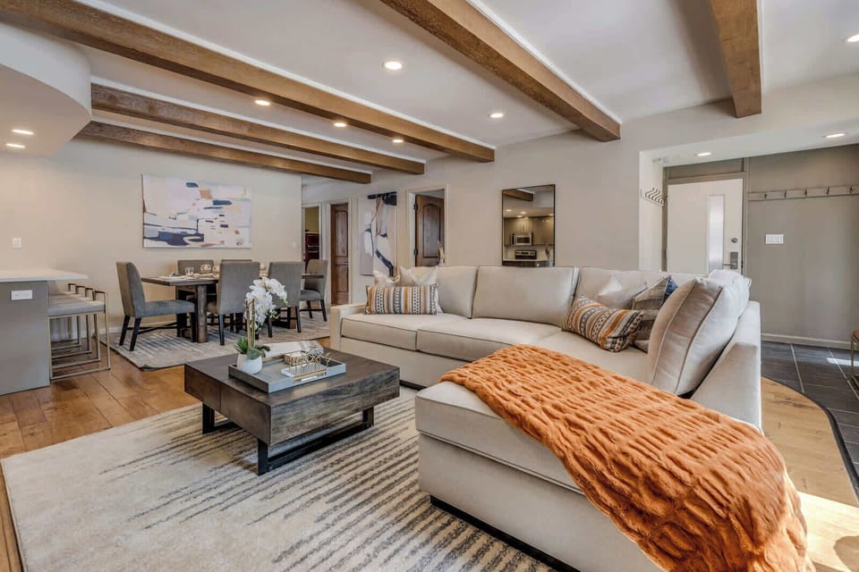 Spacious living room with large comfortable sofa, gas fireplace and Smart TV with streaming services and Xfinity cable