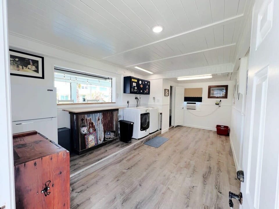 Note: new refrigerator and sink with prep area in bar