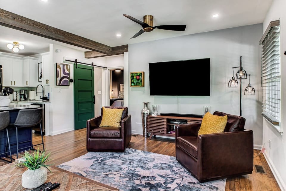 The cozy living room is fitted with a leather couch, chairs, and a Smart TV so you can relax and enjoy your favorite shows. Wind down in the evenings by playing one of the board games provided.